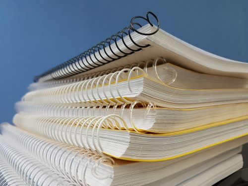 pile of used notebooks