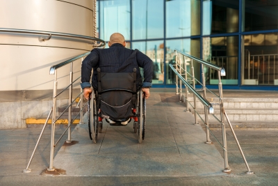Man on wheelchair ramp