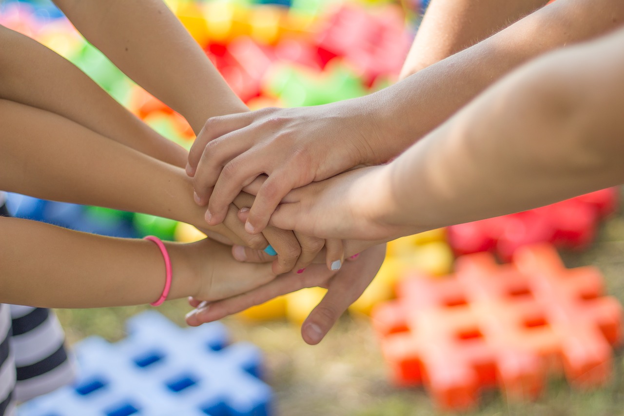 several hands holding